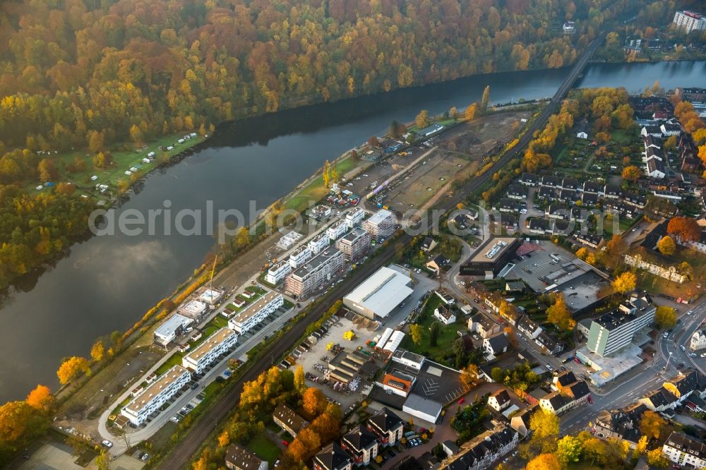 Aerial photograph Kettwig - View of the autumnal Kettwig on the riverbank of the Ruhr with the industrial area on Ruhrtalstrasse in the state of North Rhine-Westphalia