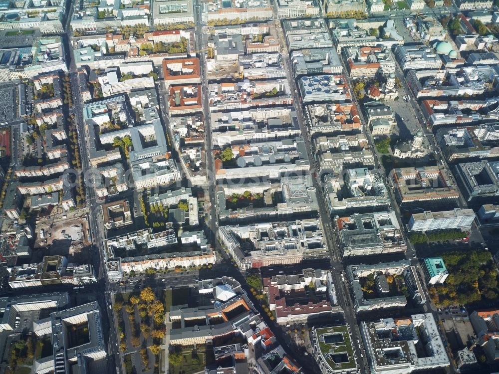 Aerial photograph Berlin - View of the historic Mitte part of the Mitte district in Berlin. Gendarmenmarkt (a former market square) is located on Charlottenstrasse - parallel to Friedrichstrasse further in the West - and is home to several historic buildings. The two cathedrals German Dom and French Dom are located on the Southern and Northern edge of the square, surrounding the concert hall. Wilhelmstrasse - a main street - takes its course in the West of the part