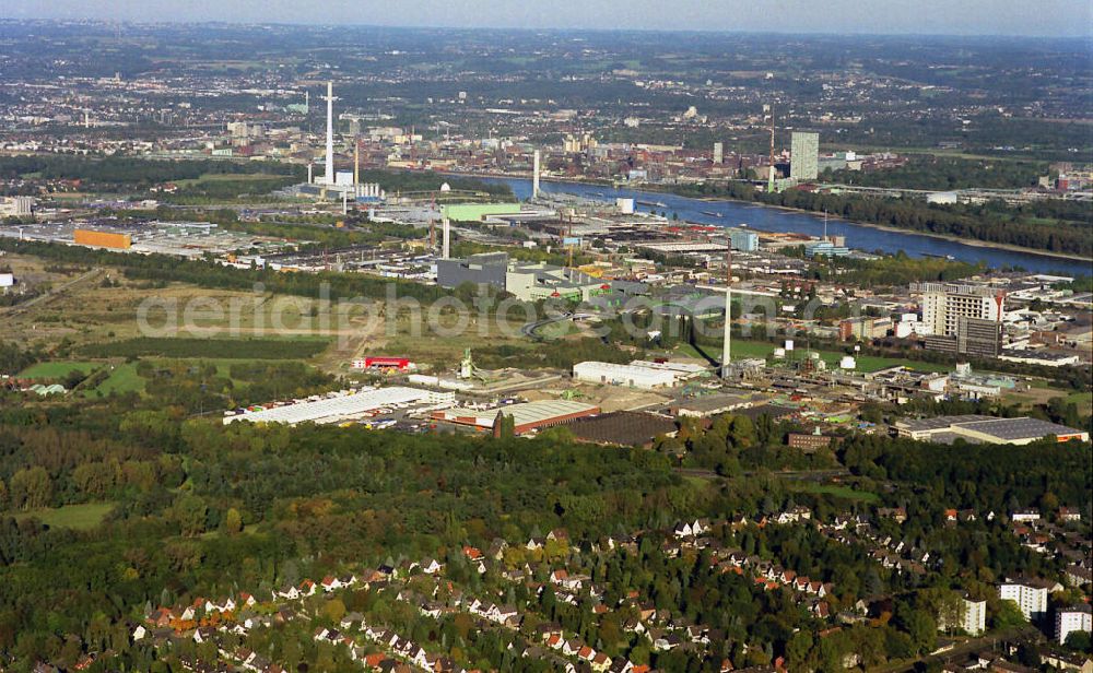 Köln from above - Stadtteilansicht Industrigebiete im Kölner Norden bei Köln-Merkenich mit den Bayerwerke in Leverkusen im Hintergrund. Partial view of the city industrial areas north of Cologne in Cologne Merkenich with Bayer Leverkusen in background.