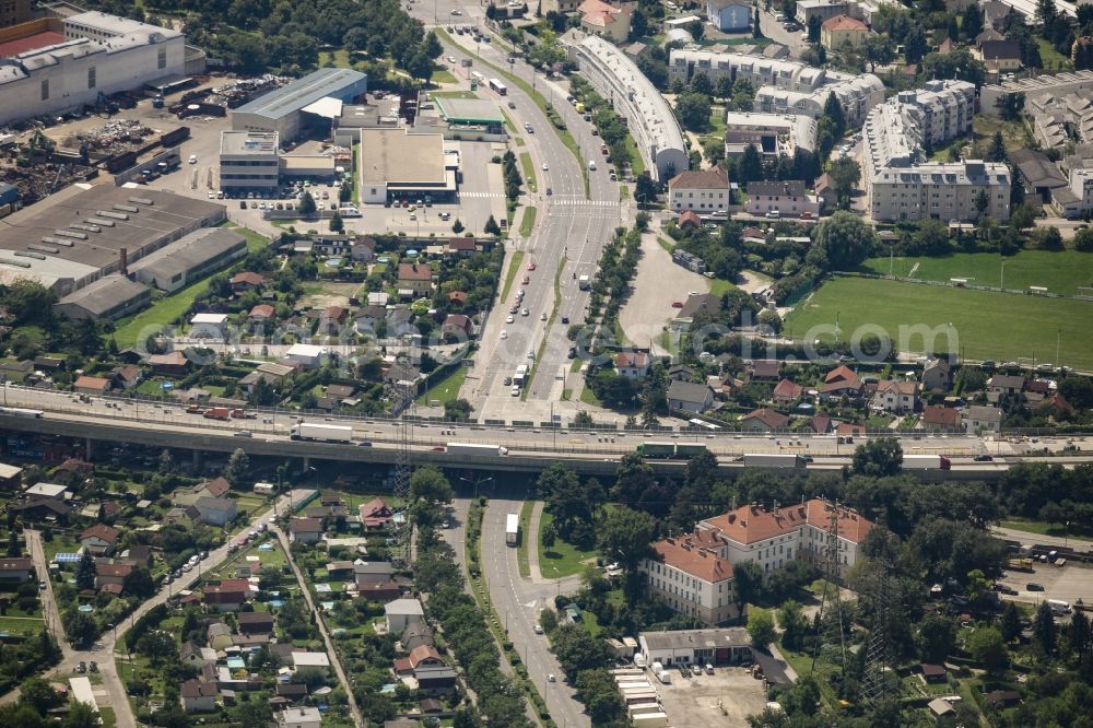 Wien from the bird's eye view: View of the Kaiserebersdorf part of the district of Simmering in Vienna in Austria. View along Zinnergasse and Etrichstrasse which is crossed by the federal motorway A4