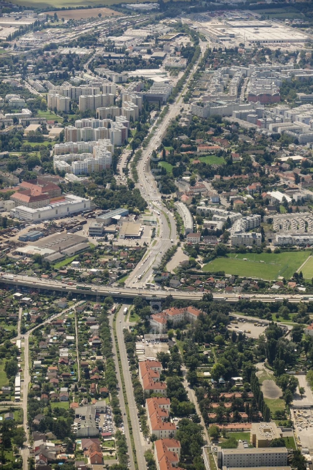 Wien from above - View of the Kaiserebersdorf part of the district of Simmering in Vienna in Austria. View along Zinnergasse and Etrichstrasse which is crossed by the federal motorway A4