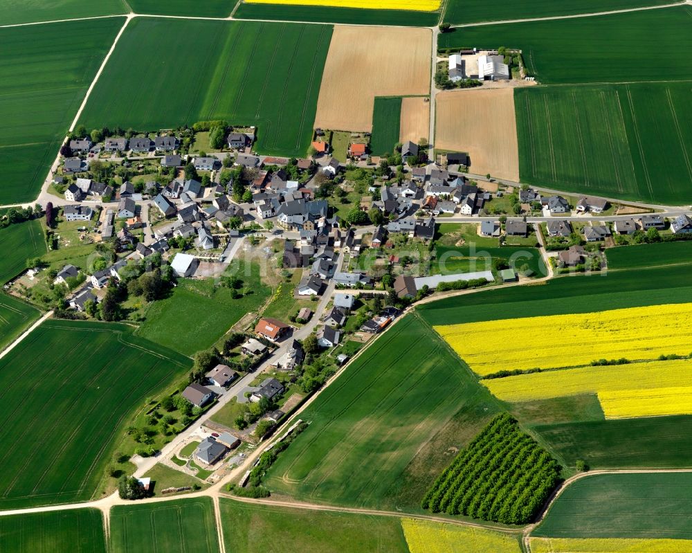 Aerial photograph Münstermaifeld - View of the Keldung part of Muenstermaifeld in the state of Rhineland-Palatinate. The agricultural town is located in the county district of Mayen-Koblenz and surrounded by meadows and rapeseed fields. It is located in the borough of Maifeld and consists of residential areas such as Keldung in the Southwest of the town