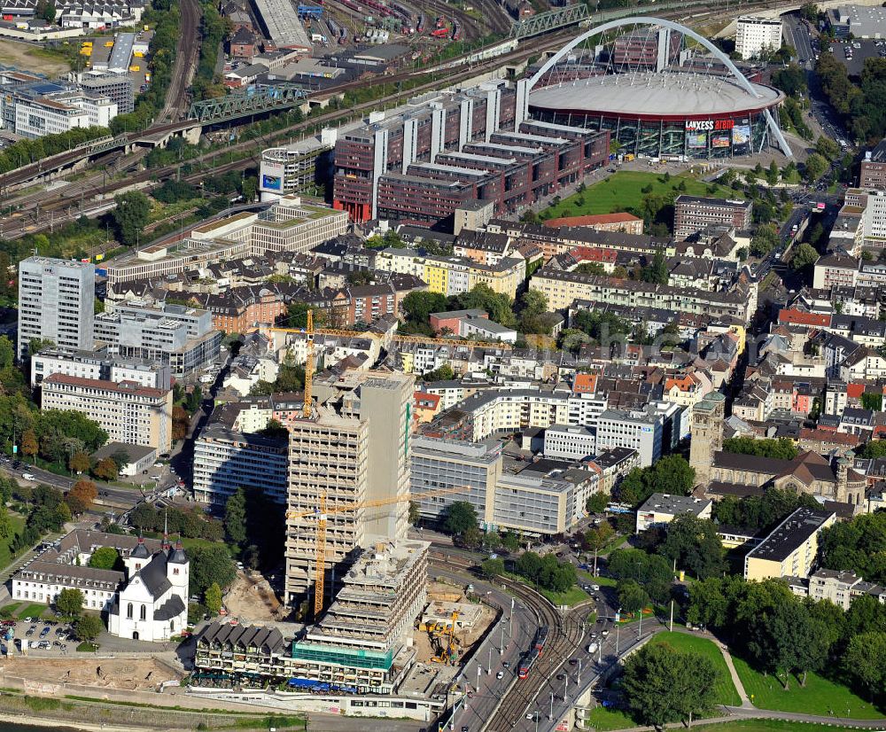 Aerial photograph Köln Deutz - Blick über den Stadtteil Deutz in Köln mit der Baustelle des maxCologne, ehemals die Lufthansa-Verwaltung, der Kirche Alt St. Heribert, dem Stadthaus Deutz, der Lanxess Arena usw. am Rheinufer / Deutzer Brücke. View over district Deutz in Cologne with construction area of maxCologne, formerly the administrative building of Lufthansa, church Old St. Heribert, town hall Deutz, the Lanxess Arena etc. at bank of the Rhine / bridge Deutzer Bruecke.