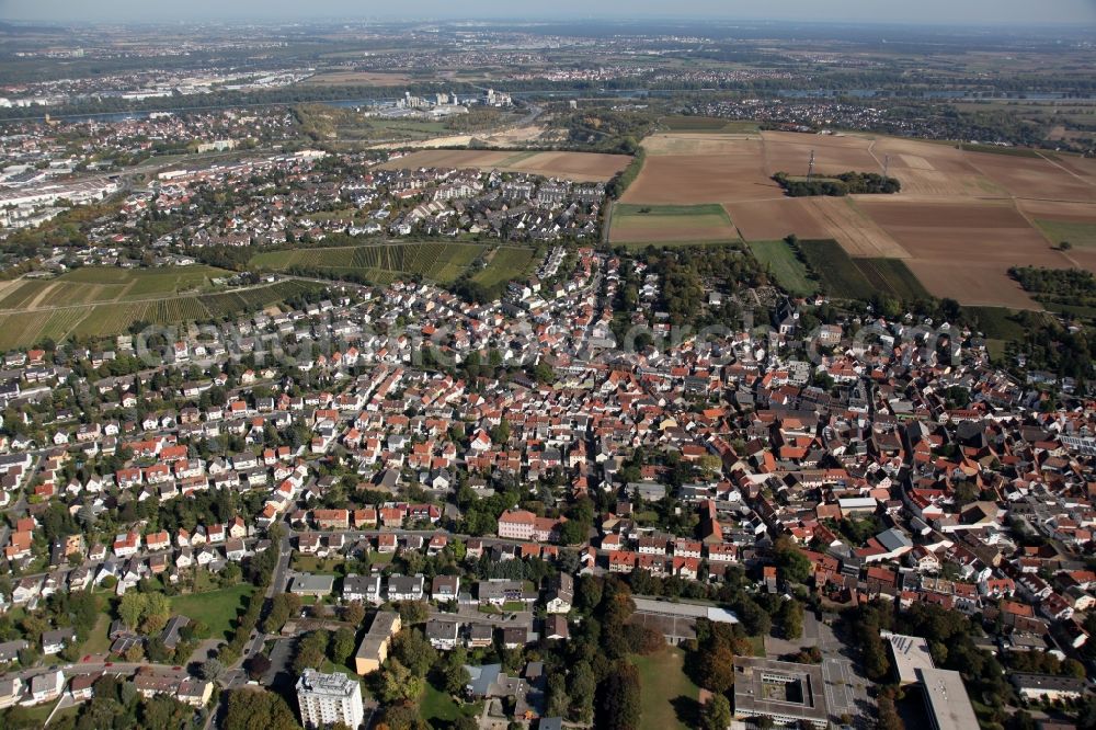 Mainz from the bird's eye view: View of the Laubenheim part of Mainz in the state of Rhineland-Palatinate. The district consists of historic residential and business buildings as well as estates and appartment blocks. It is located on the riverbank of the Rhine, in the South of Mainz, and is partly surrounded by fields and agricultural land