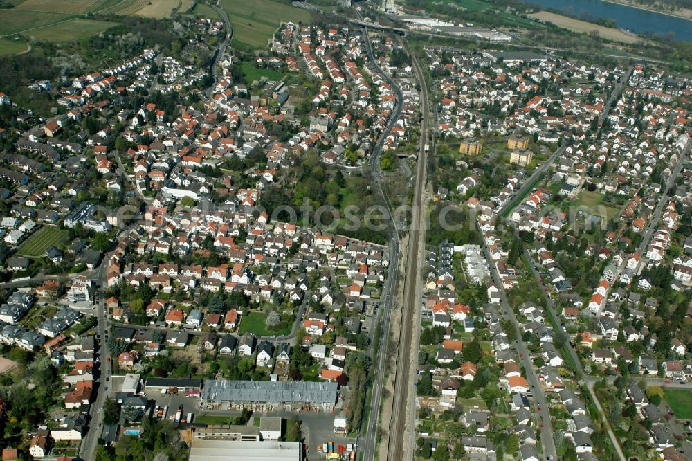 Mainz from the bird's eye view: View of the Laubenheim part of Mainz in the state of Rhineland-Palatinate. The district consists of historic residential and business buildings as well as estates and appartment blocks. It is located on the riverbank of the Rhine, in the South of Mainz, and is partly surrounded by fields and agricultural land