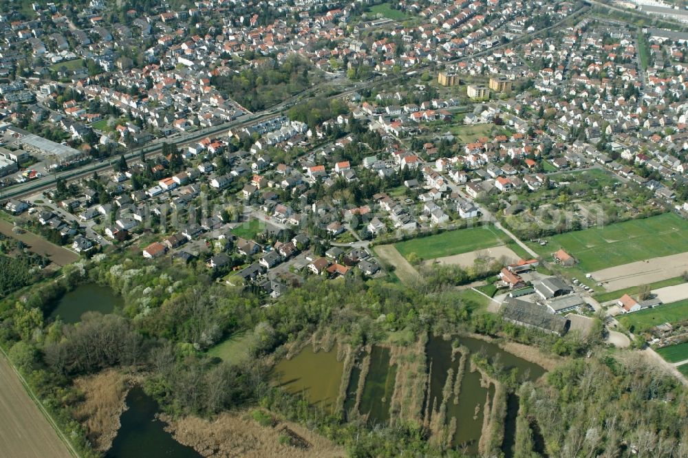 Mainz from the bird's eye view: View of the Laubenheim part of Mainz in the state of Rhineland-Palatinate. The district consists of historic residential and business buildings as well as estates and appartment blocks. It is located on the riverbank of the Rhine, in the South of Mainz, and is partly surrounded by fields and agricultural land