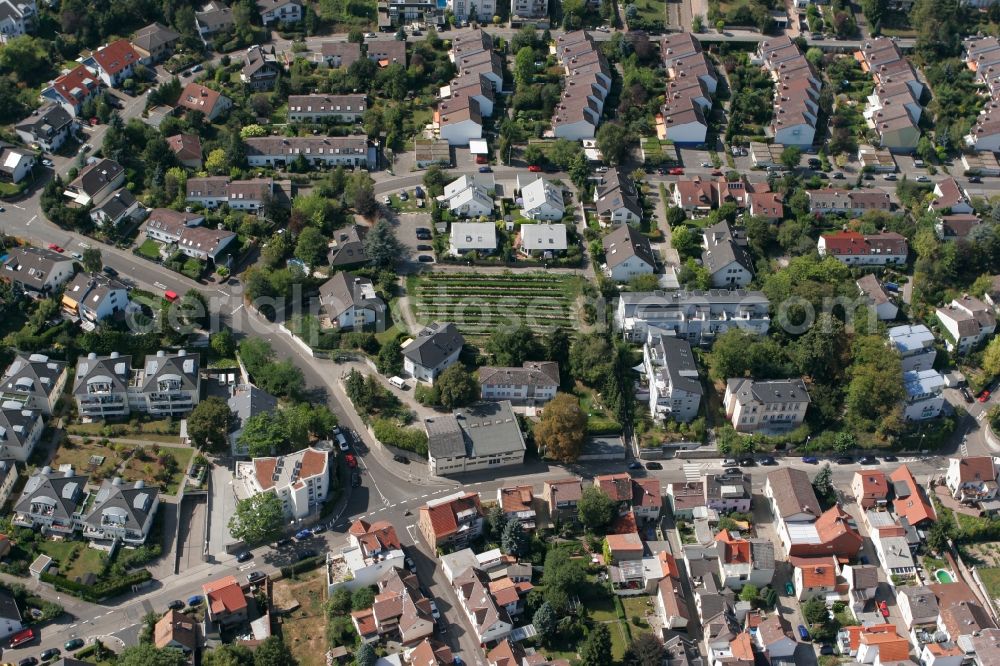 Mainz from the bird's eye view: View of the Laubenheim part of Mainz in the state of Rhineland-Palatinate. The district consists of historic residential and business buildings as well as estates and appartment blocks. It is located on the riverbank of the Rhine, in the South of Mainz, and is partly surrounded by fields and agricultural land