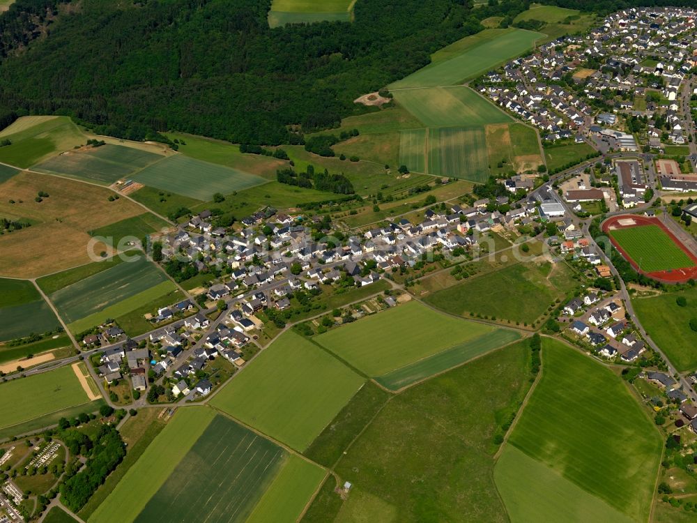 Emmelshausen from the bird's eye view: View of the Lieselscheid part of the town of Emmelshausen in the state of Rhineland-Palatinate. The town is an official spa resort in the county district of Rhine-Hunsrueck, surrounded by fields, meadows and forest