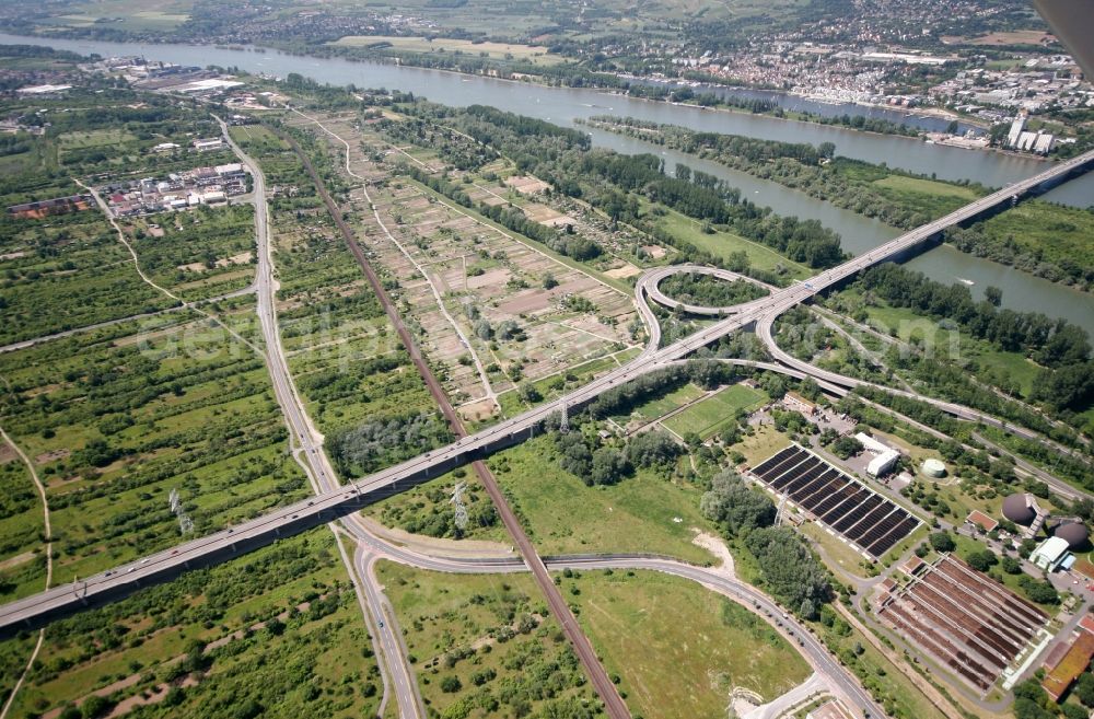 Mainz from above - View of the Mombach district of Mainz in the state of Rhineland-Palatinate. The Northern-most district is located on the river Rhine and borders the federal motorway A643 in the West - which crosses the river and the Rhine island.. The former industrial borough is characterised by businesses, commercial areas and extensive green spaces