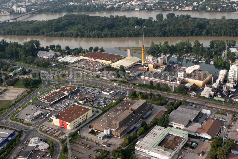 Mainz from above - View of the Mombach district of Mainz in the state of Rhineland-Palatinate. The Northern-most district is located on the river Rhine and borders the federal motorway A643 in the West. The former industrial borough is characterised by businesses, commercial areas and extensive green spaces