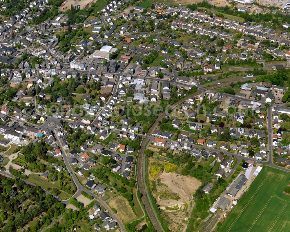 Aerial image Mendig - View of the Niedermendig part of Mendig in the state Rhineland-Palatinate. The town is located in the county district of Mayen-Koblenz in the Eastern Eifel region. It is known as a town of breweries and lava cellars - from volcanic origin. Mendig consists of two parts. Niedermendig is crossed by the Kellbach creek