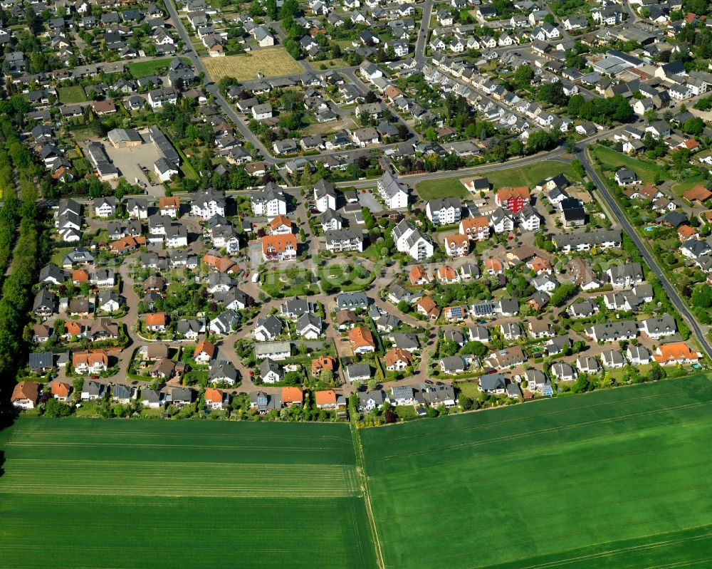 Polch from above - View of the North of Polch in the state of Rhineland-Palatinate. The agricultural town is located in the county district of Mayen-Koblenz and surrounded meadows and rapeseed fields. It is located in the borough of Maifeld, in the South of the federal motorway A 48. The North consists of residential areas with single family homes on the edge of agricultural and rapeseed fields as well as industrial areas