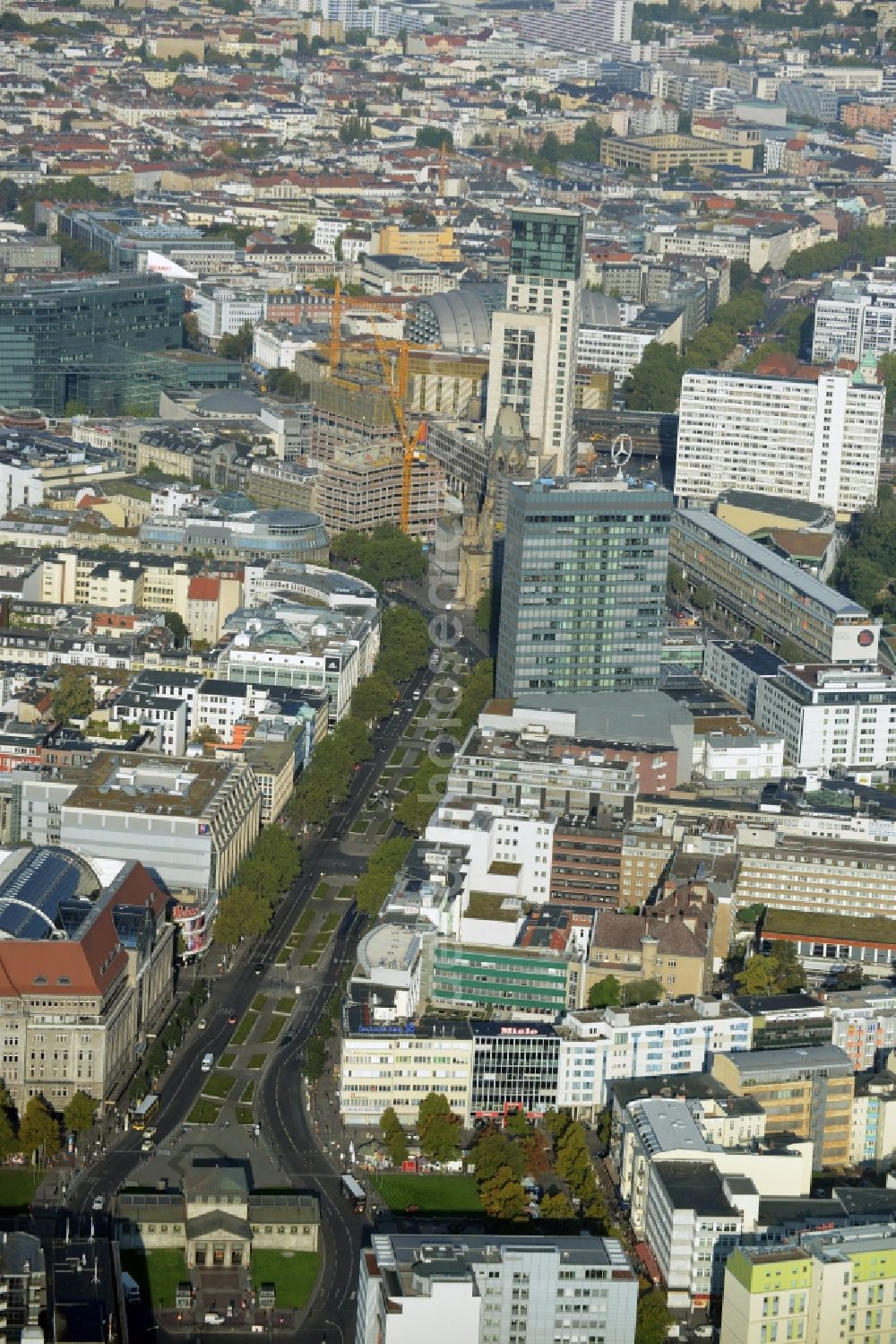 Berlin from above - View along Tauentzienstrasse of the Charlottenburg part of Berlin in Germany. The background shows the Protestant Kaiser Wilhelm Memorial Church and Europa Center on Breitscheidplatz, the foreground shows the department store of the West KaDeWe and the historic U-Bahn station Wittenbergplatz