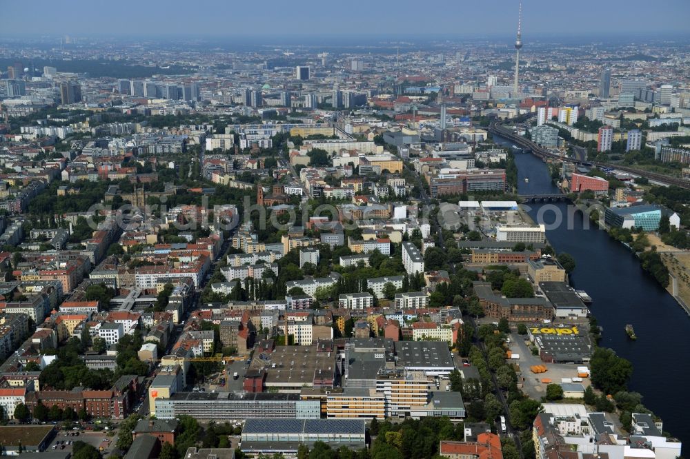 Aerial photograph Berlin - View of the Kreuzberg part of Berlin. View along Koepenicker Strasse and the course of the river Spree towards Mitte. The broadcasting tower on Alexanderplatz is visible in the background