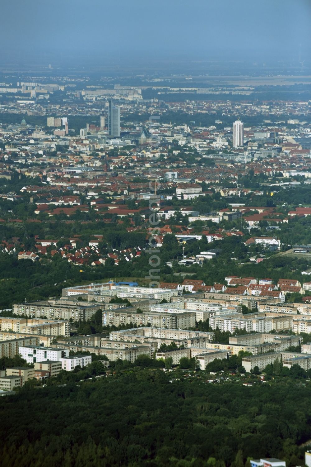 Taucha from the bird's eye view: Skyscrapers in the residential area of industrially manufactured settlement destrict Paunsdorf in Leipzig in the state Saxony