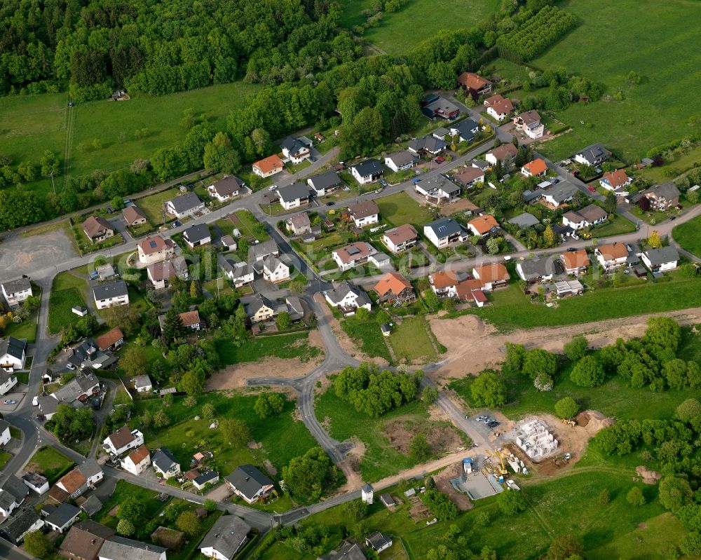 Aerial image Westerburg - View of the Sainscheid part of the town of Westerburg in the state of Rhineland-Palatinate. The town is located in the county district of Westerwaldkreis, is an official tourist resort and widely known for the castle hill and its castle. Sainscheid is located in the South of the town area, surrounded by fields, meadows and forest