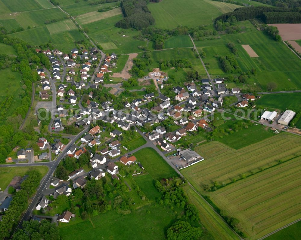 Aerial photograph Westerburg - View of the Sainscheid part of the town of Westerburg in the state of Rhineland-Palatinate. The town is located in the county district of Westerwaldkreis, is an official tourist resort and widely known for the castle hill and its castle. Sainscheid is located in the South of the town area, surrounded by fields, meadows and forest