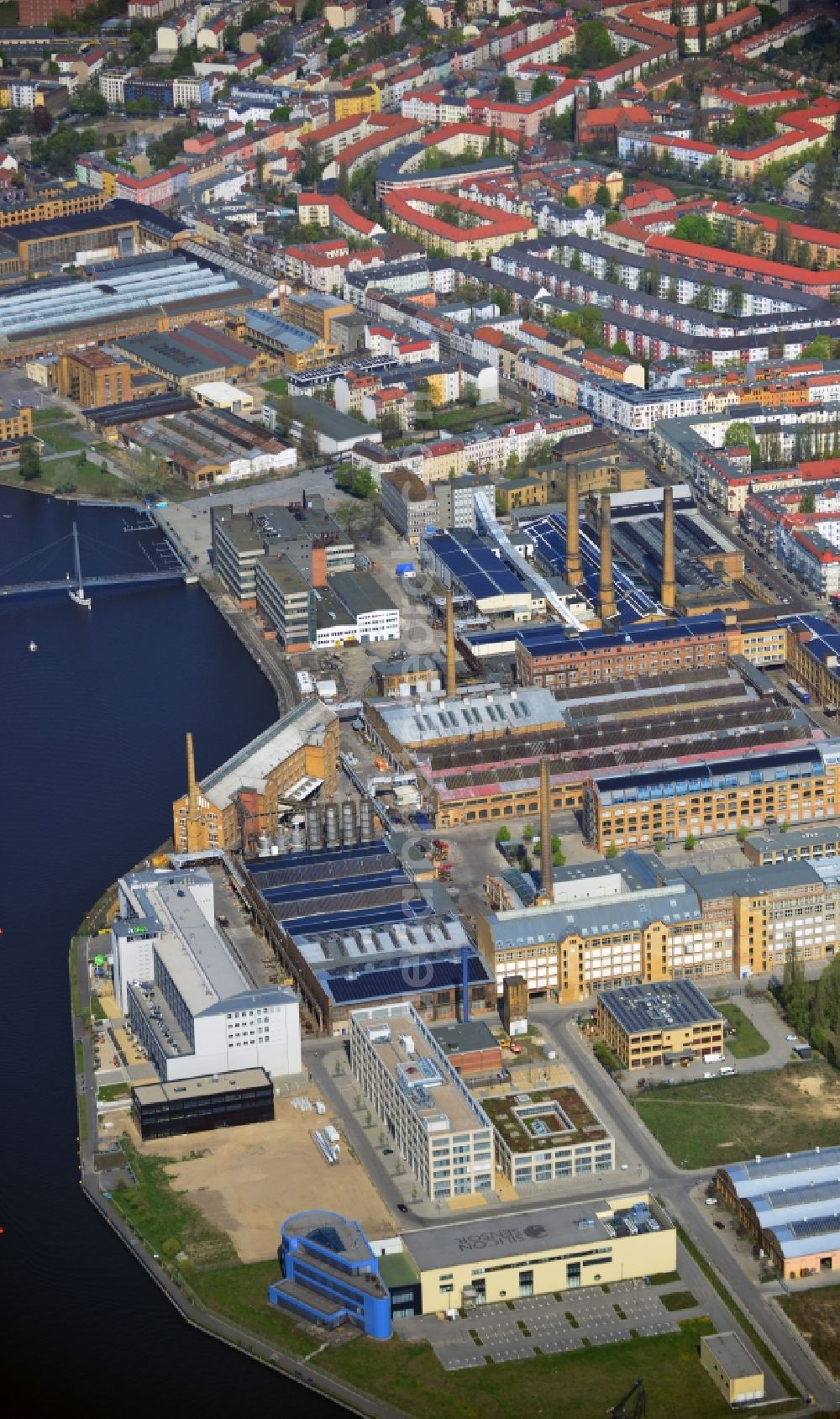 Berlin from above - View of Schöneweide in the Berlin borough Treptow-Köpenick. Schöneweide is the designation for the two districts Niederschöneweide and Oberschöneweide in the borough Treptow-Köpenck. The river Spree separates the two districts from each other