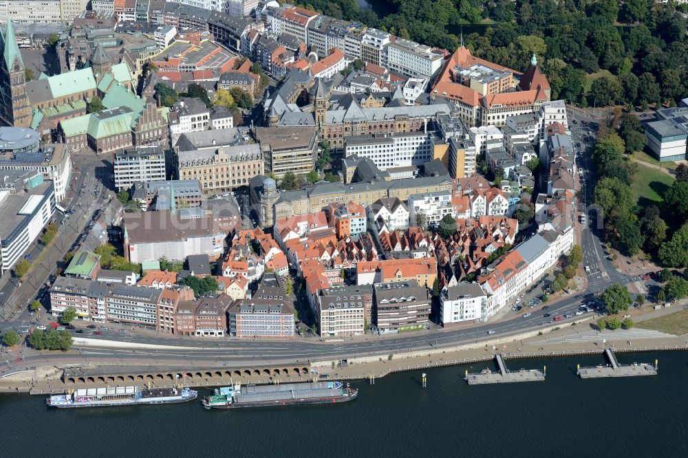 Bremen from the bird's eye view: View of the Schnoor quarter in the historic city centre and on the riverbank of the Weser in Bremen in Germany. The medieval quarter is located in the South of the city centre and along the street of the same name