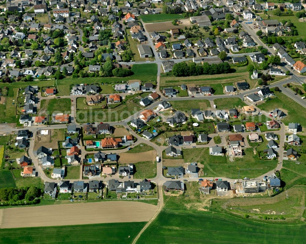 Polch from the bird's eye view: View of the Southwest of Polch in the state of Rhineland-Palatinate. The agricultural town is located in the county district of Mayen-Koblenz and surrounded meadows and rapeseed fields. It is located in the borough of Maifeld, in the South of the federal motorway A 48. The Southwest consists of residential areas with single family homes on the edge of agricultural and rapeseed fields