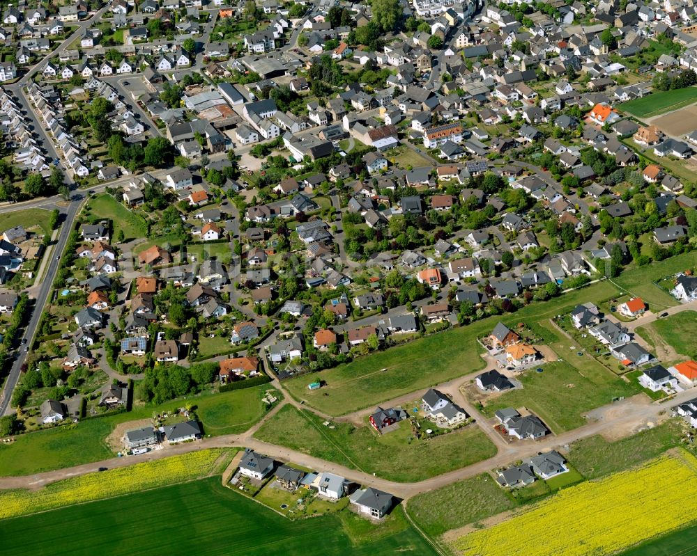 Aerial image Polch - View of the Southwest of Polch in the state of Rhineland-Palatinate. The agricultural town is located in the county district of Mayen-Koblenz and surrounded meadows and rapeseed fields. It is located in the borough of Maifeld, in the South of the federal motorway A 48. The Southwest consists of residential areas with single family homes on the edge of agricultural and rapeseed fields