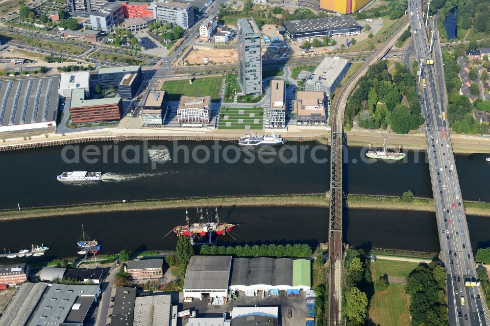 Bremen from above - View of the urban development area Ueberseestadt in the North of Stephani Bridge on the riverbank of the Weser in Bremen in Germany. The quarter is being developed on site of former harbour and port areas. The highrise Wesertower is located in the North of the river