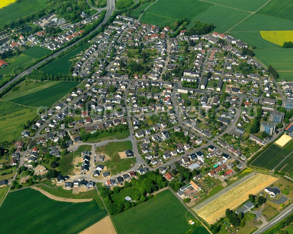 Aerial image Neuwied - View of the Torney part of the town of Neuwied in the state of Rhineland-Palatinate. The town is located in the county district of Mayen-Koblenz on the right riverbank of the river Rhine. The town is an official tourist resort and is an important historic industrial site. Torney is located in its Northwest, surrounded by meadows and rapeseed fields on the edge of the Nature Park Rhine-Westerwald, adjacent to the federal highway B256