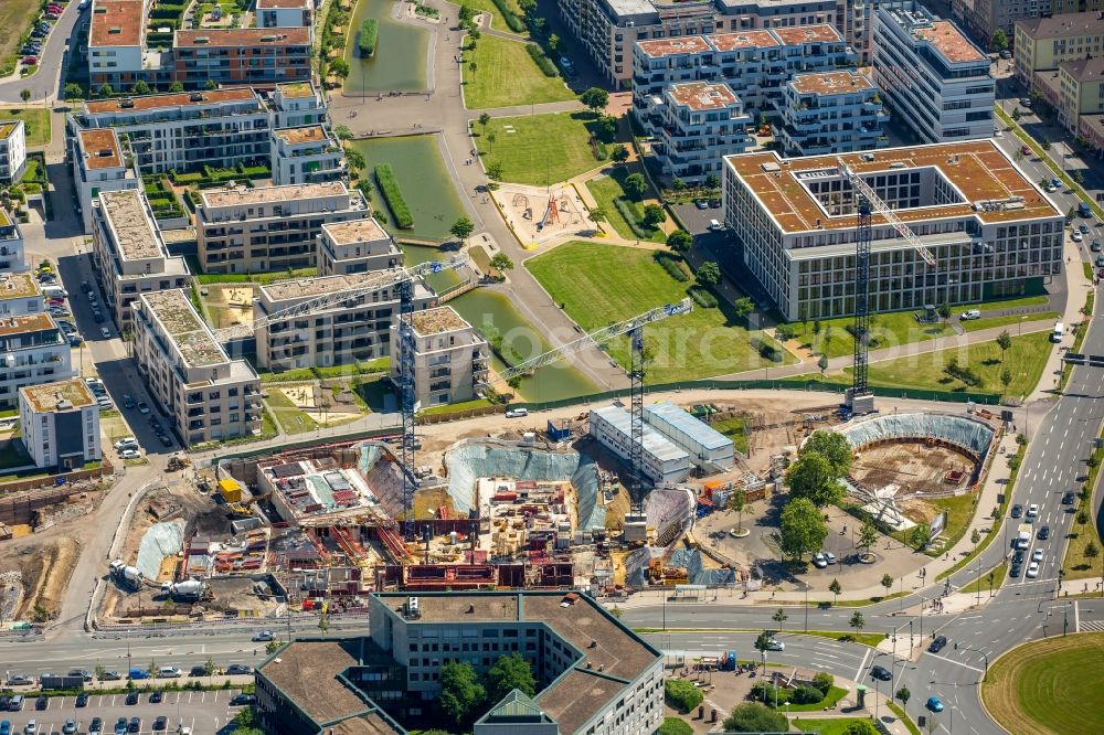 Essen from above - View of the University Quarter and the construction site for the office building of Funke Media Group on Berliner Platz in Essen in the state of North Rhine-Westphalia. The shopping mall Limbecker Platz is located in the foreground