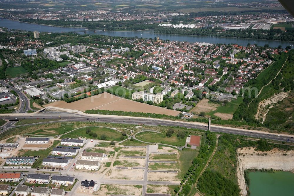 Mainz from above - View of the Weisenau part of Mainz in the state of Rhineland-Palatinate. The district consists of a historic centre with old residential and business buildings as well as estates and appartment blocks. It is located on the riverbank of the Rhine and partly green and wooded. The district borders the federal motorway A60 in the Southwest with a commercial and industrial area