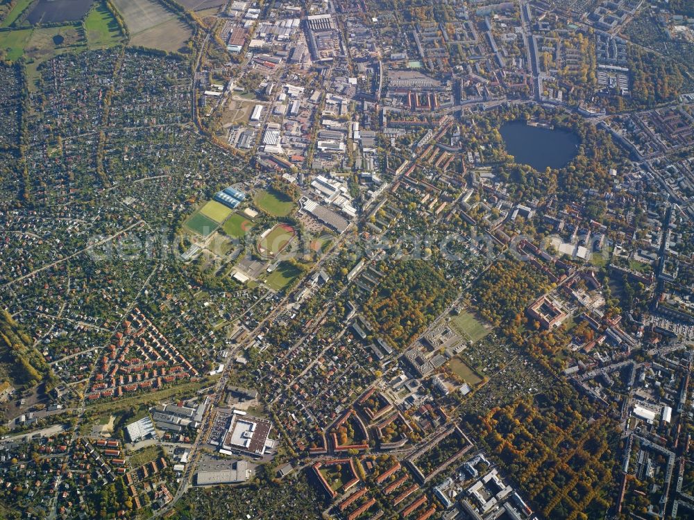 Aerial image Berlin - View of the Weissensee part of the district of Pankow in Berlin. A large sports park with halls and open air facilities is located on Rennbahnstrasse. The lake of Weissensee is located in a park on Berliner Allee