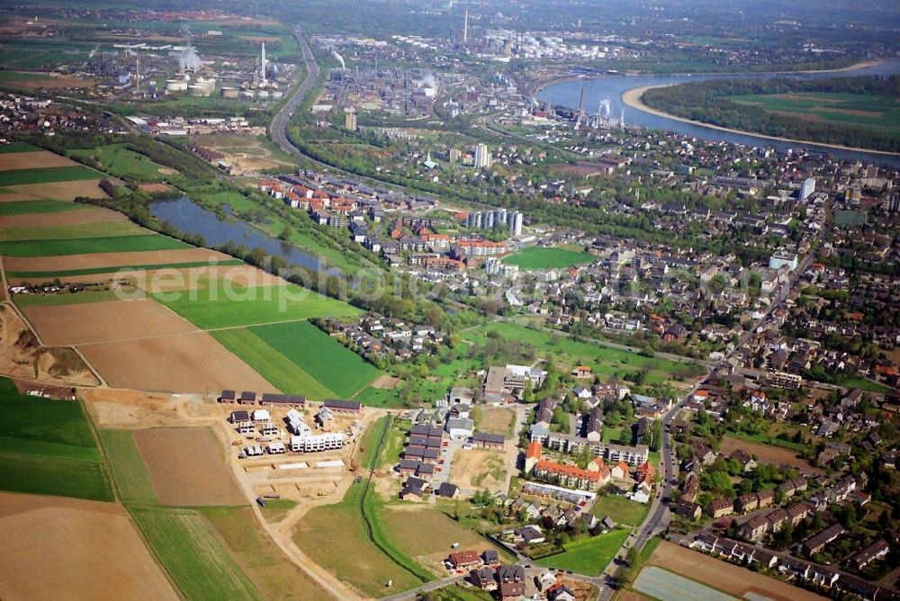 Aerial photograph Wesseling - Partial city view of Wesseling overlooking the residential and industrial areas and the landscape of the city and the river Rhine in the state of North Rhine-Westphalia