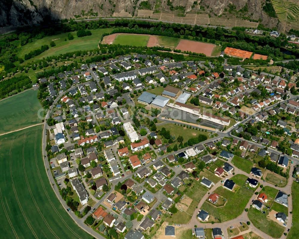 Bad Münster am Stein-Ebernburg from above - View of the Western part of Bad Muenster am Stein-Ebernburg part of Bad Kreuznach in the state of Rhineland-Palatinate. Bad Muenster is a spa resort and has been made a district of Bad Kreuznach in 2014. It is located in the valley of the river Nahe, surrounded by forest which are landmarks and important tourist sites, forest and vineyards. The West includes several sports grounds and pitches on the Nahe riverbank