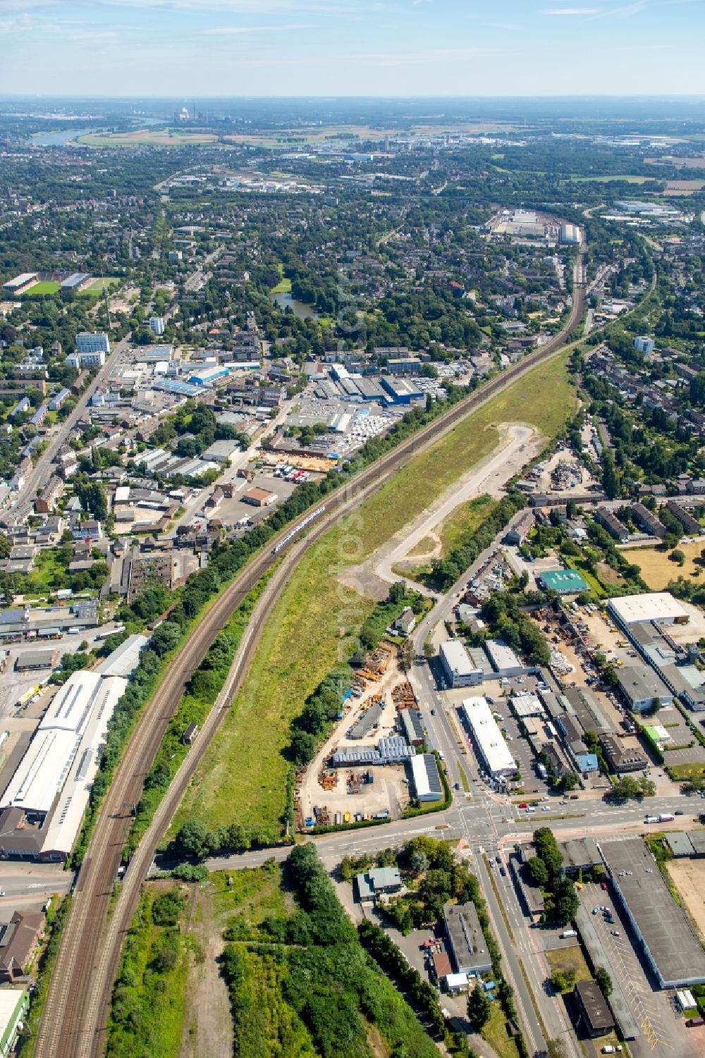 Krefeld from the bird's eye view: View of the West of Krefeld with industrial and commercial areas along railway tracks in the state of North Rhine-Westphalia