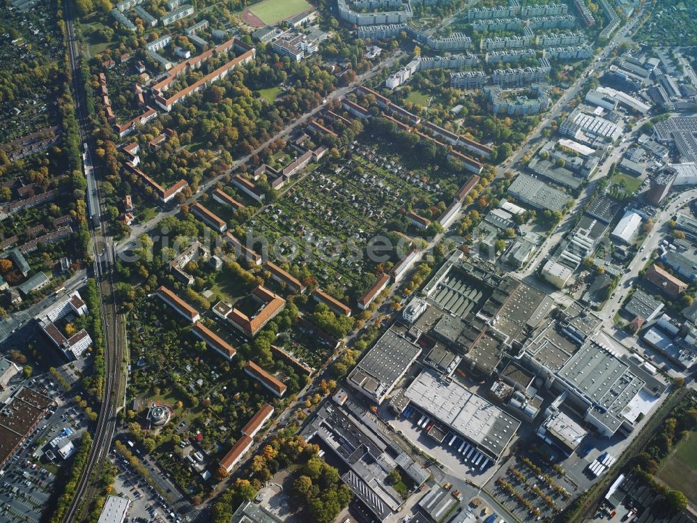 Berlin from above - View of a residential area along Sonnenallee in the district of Neukoelln in Berlin in Germany. The area consists of several residential estates and parks. The High-Deck-Estate with its high-rises is located around Sonnenallee and next to the sports facilities. S-Bahn station Koellnische Heide is located on the rail line in the North of the area