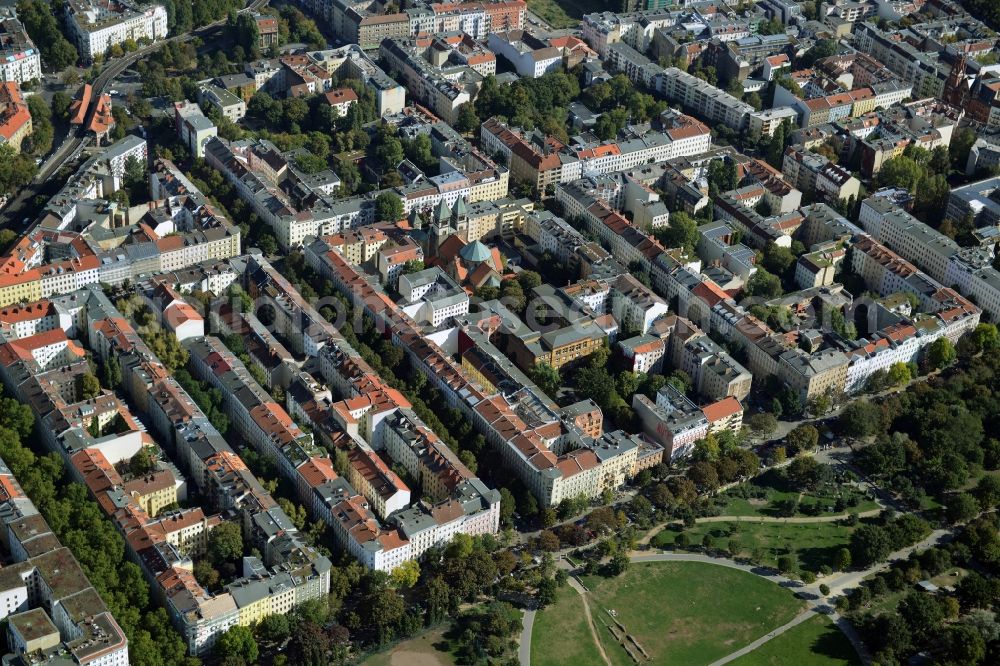 Berlin from above - View of a residential area on the Northern exit of Goerlitzer Park in the Kreuzberg part of Berlin in Germany. The area consists of historic estates and backyards. St.Marien Liebfrauen Church is located here as well