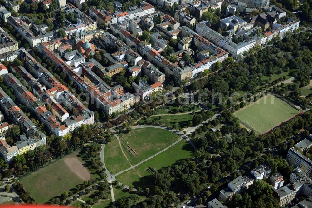 Berlin from the bird's eye view: View of a residential area on the Northern exit of Goerlitzer Park in the Kreuzberg part of Berlin in Germany. The area consists of historic estates and backyards. St.Marien Liebfrauen Church is located here as well