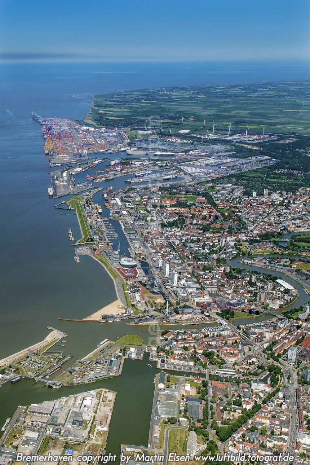 Bremerhaven from above - Districts Mitte, Lehe und Stadtbremisches Ueberseehafengebiet with its residential areas and port facilities and the nearby river Geeste aswell as the mouth of the river Weser joining the North Sea in the city Bremerhaven in the state Bremen