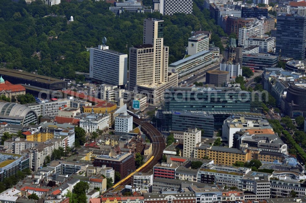 Aerial image Berlin - Group of buildings alongside the S-Bahn-track between the streets Kurfuerstendamm und Kantstrasse in the district Berlin Charlottenburg. You can see parts of the train station, the CityQuartier Neues Kanzler-Eck, the highrise Zoofenster, the church Kaiser-Wilhelm-Gedaechtniskirche and the reconstructed Bikini-Haus