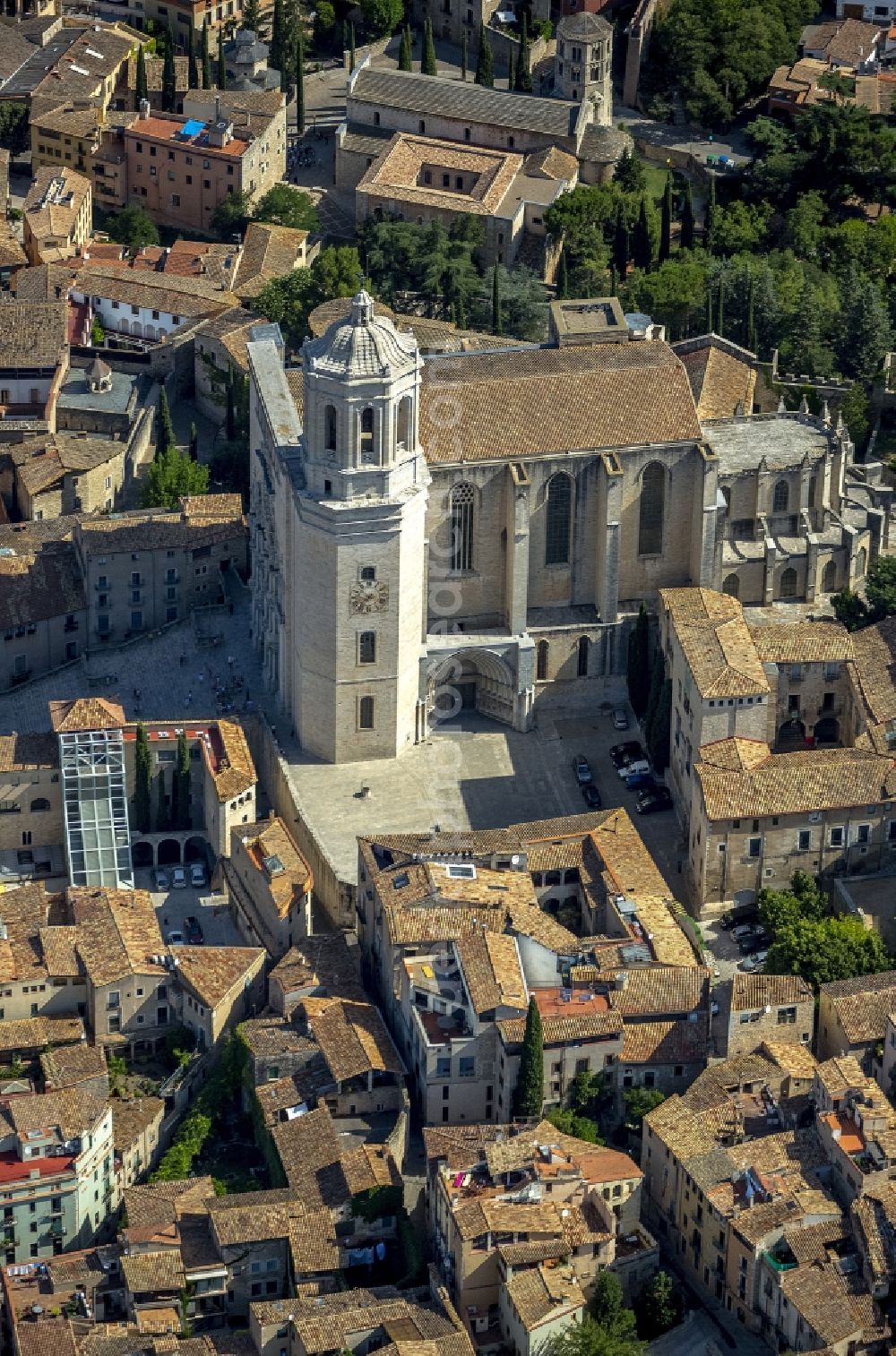 Aerial image Girona - City center of downtown with the Catedrale de Santa Maria de Girona and Sant Feliu church in Girona in Spain