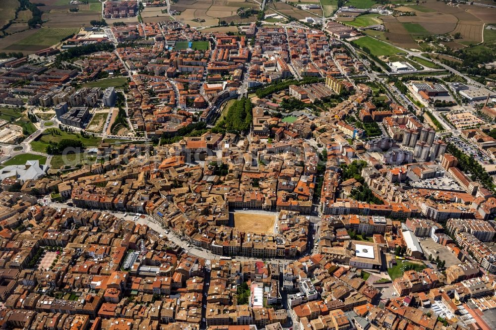 Vic from the bird's eye view: City center of downtown with its historic old town with Placa Major square in Vic, Spain