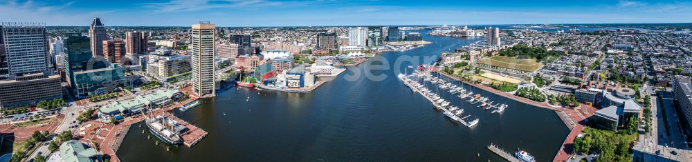 Baltimore from the bird's eye view: City center in the downtown area on the banks of river course Inner Harbour on street North Calvert Street in Baltimore in Maryland, United States of America