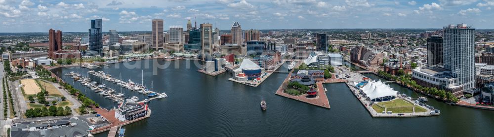 Aerial image Baltimore - City center in the downtown area on the banks of river course Inner Harbour on street North Calvert Street in Baltimore in Maryland, United States of America