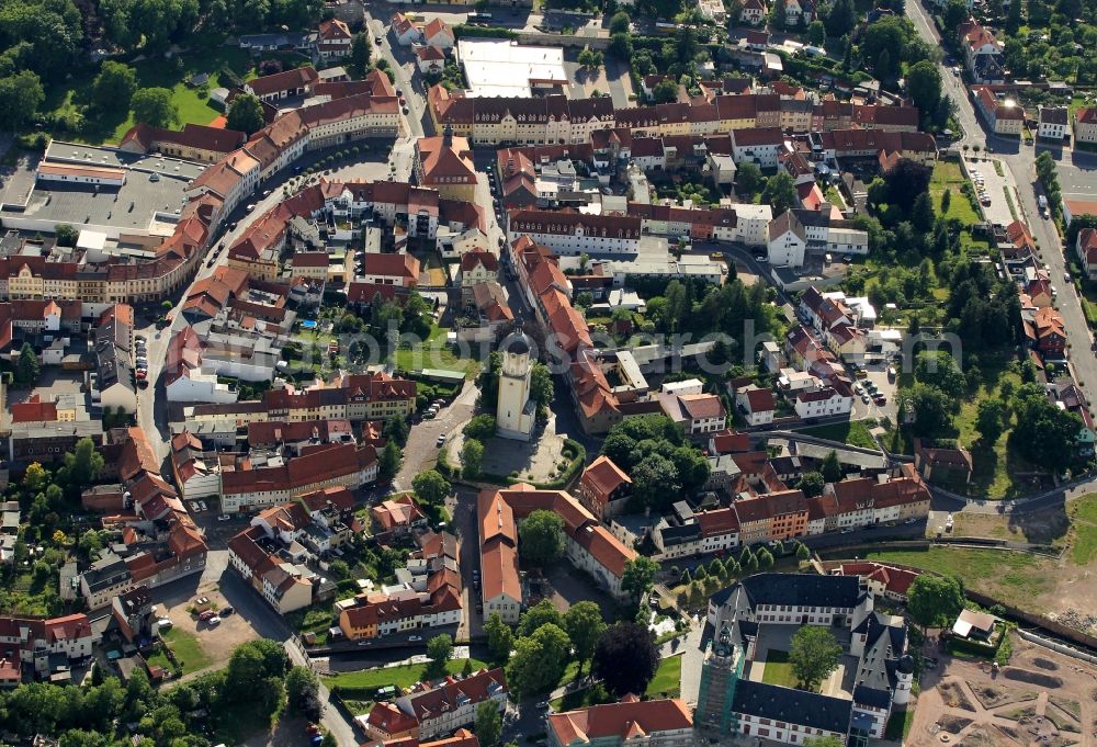 Ohrdruf from above - Two points of interest include the city center of Ohrdruf in Thuringia. The former city church St. Michaelis was razed to the surviving tower at the end of WW2. From the tower, which have one of the landmarks of the city, the visitors a good view of the old town and the surrounding area. In the church of the famous church musician Johann Sebastian Bach had the play the organ from his brother learned. On the market is the historic town hall, which was built in the 19th century. In the right foreground the Ehrenstein Castle can be seen, which was restored at the time of recording