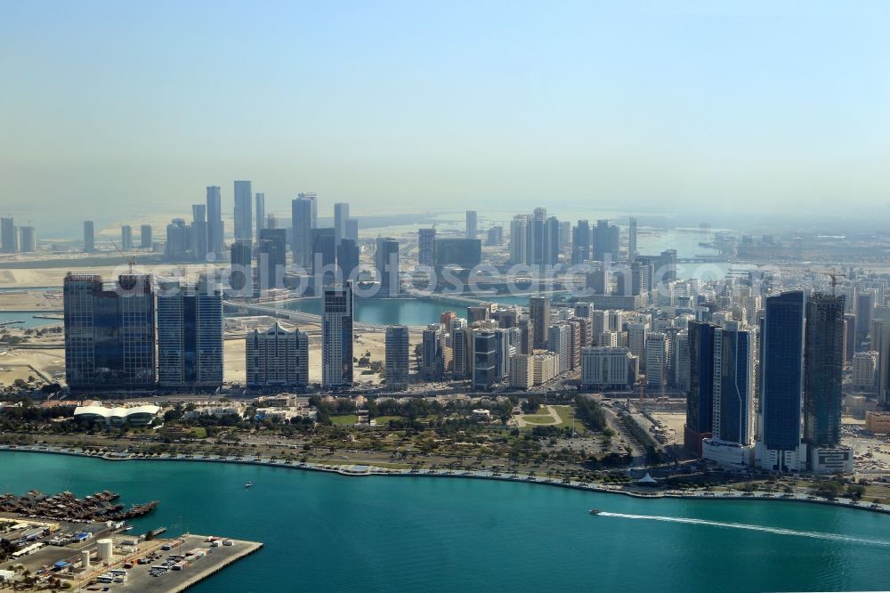 Aerial photograph Abu Dhabi - City center with the skyline in the area at the Heritage Park at the entrance to the Dhow Harbour in Abu Dhabi in United Arab Emirates