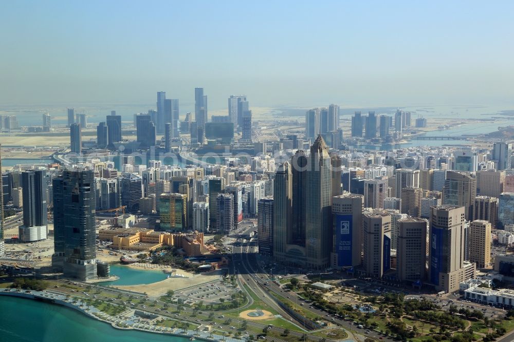 Aerial photograph Abu Dhabi - City center with the skyline in the downtown area at the Recreation Park on the shore of the Persian Gulf in Abu Dhabi in United Arab Emirates