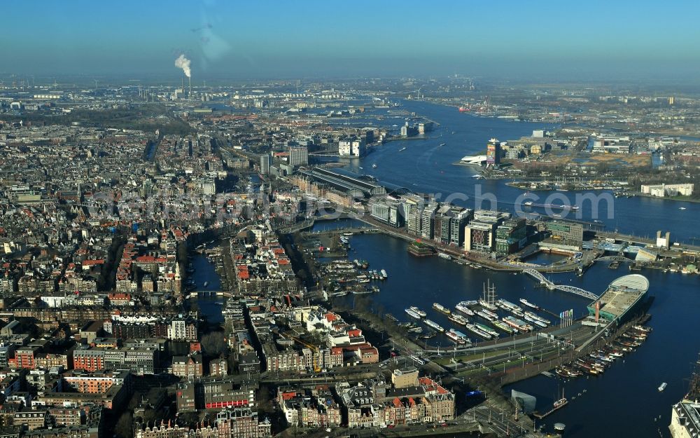 Amsterdam from above - City center with districts Nieuwmarkt en Lasttageund De Wallen Binnenstadt of Amsterdam in the Netherlands