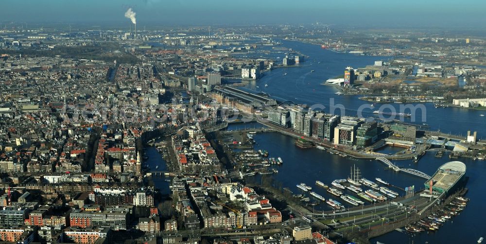 Amsterdam from the bird's eye view: City center with districts Nieuwmarkt en Lasttageund De Wallen Binnenstadt of Amsterdam in the Netherlands