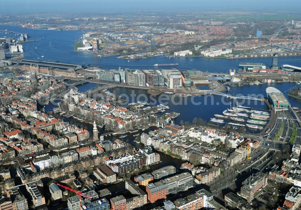 Amsterdam from above - City center with districts Nieuwmarkt en Lasttageund De Wallen Binnenstadt of Amsterdam in the Netherlands