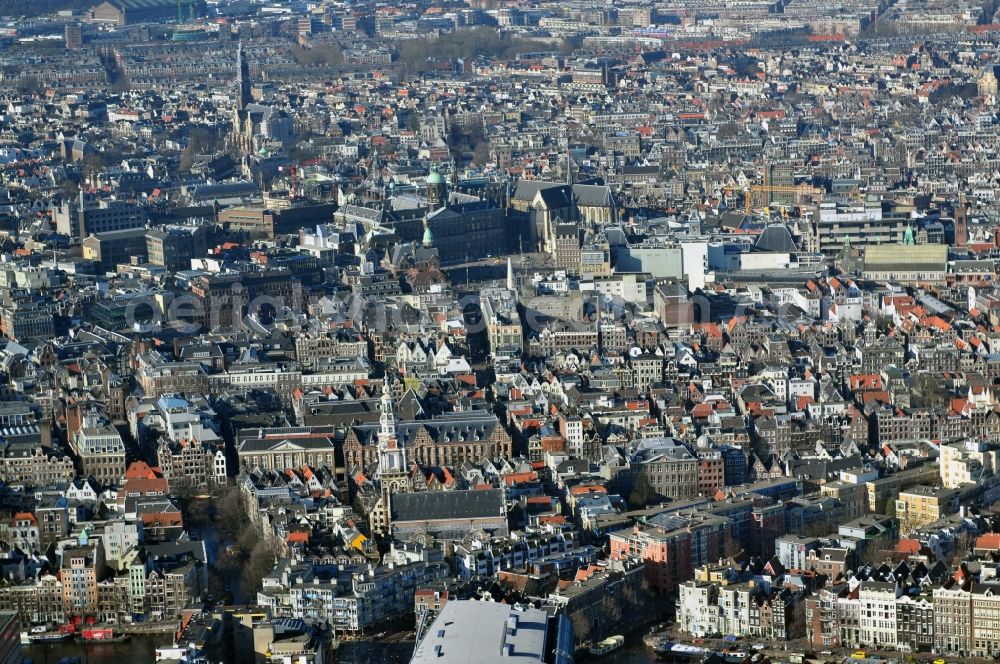 Amsterdam from the bird's eye view: City center with residential areas and canals channels at the church Oude Kerk in the center of Amsterdam in the Netherlands