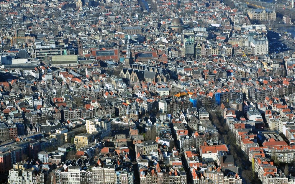 Aerial image Amsterdam - City center with residential areas and canals channels at the church Oude Kerk in the center of Amsterdam in the Netherlands